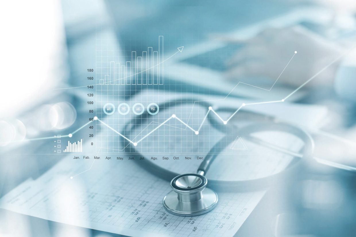 Several graphs measuring performance and medical reports with a stethoscope in the background.