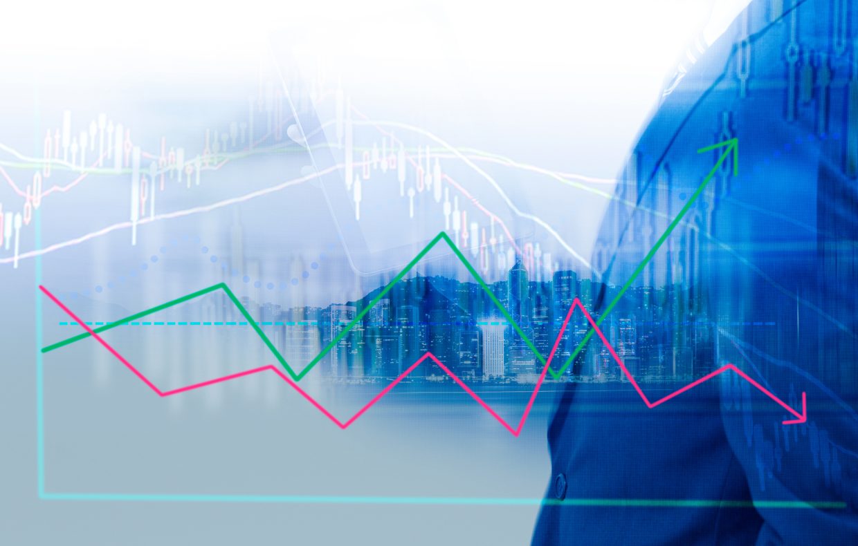 Graph showing negative and positive growth overlaid over a suit-clad figure.