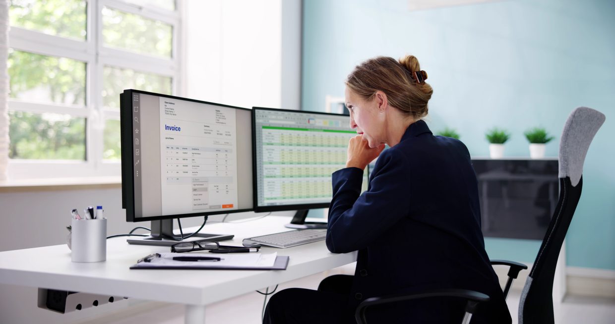 Person working in Healthcare looking at medical coding